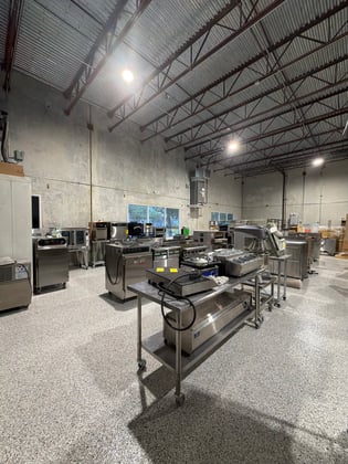 neatly organized warehouse with commercial foodservice equipment