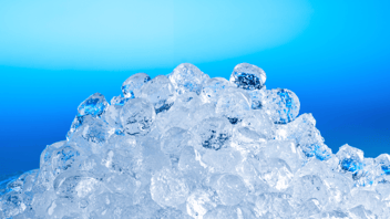 Pile of Follett ice against blue background