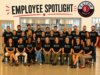 Group of employees with black t-shirts on and the words employee spotlight above them with the Eaton Marketing logo