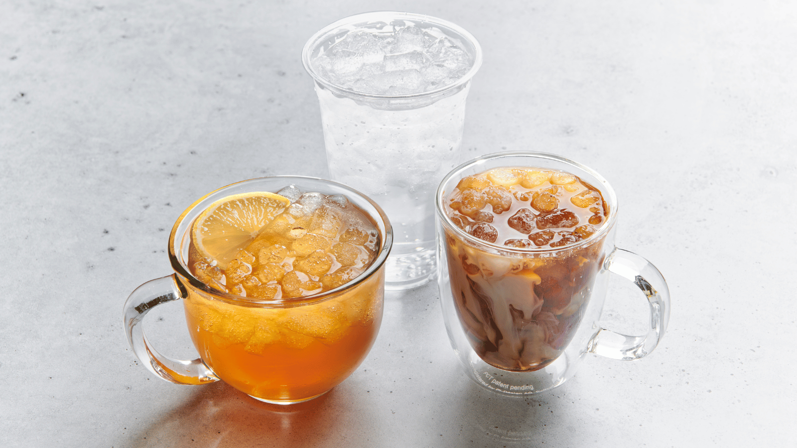Three drinks in different glasses have tea, coffee and a clear drink and have Chewblett ice in them.