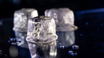 ice cubes melting on a black background