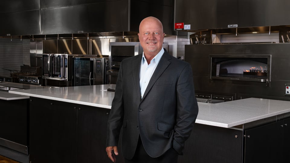 man standing in a test kitchen